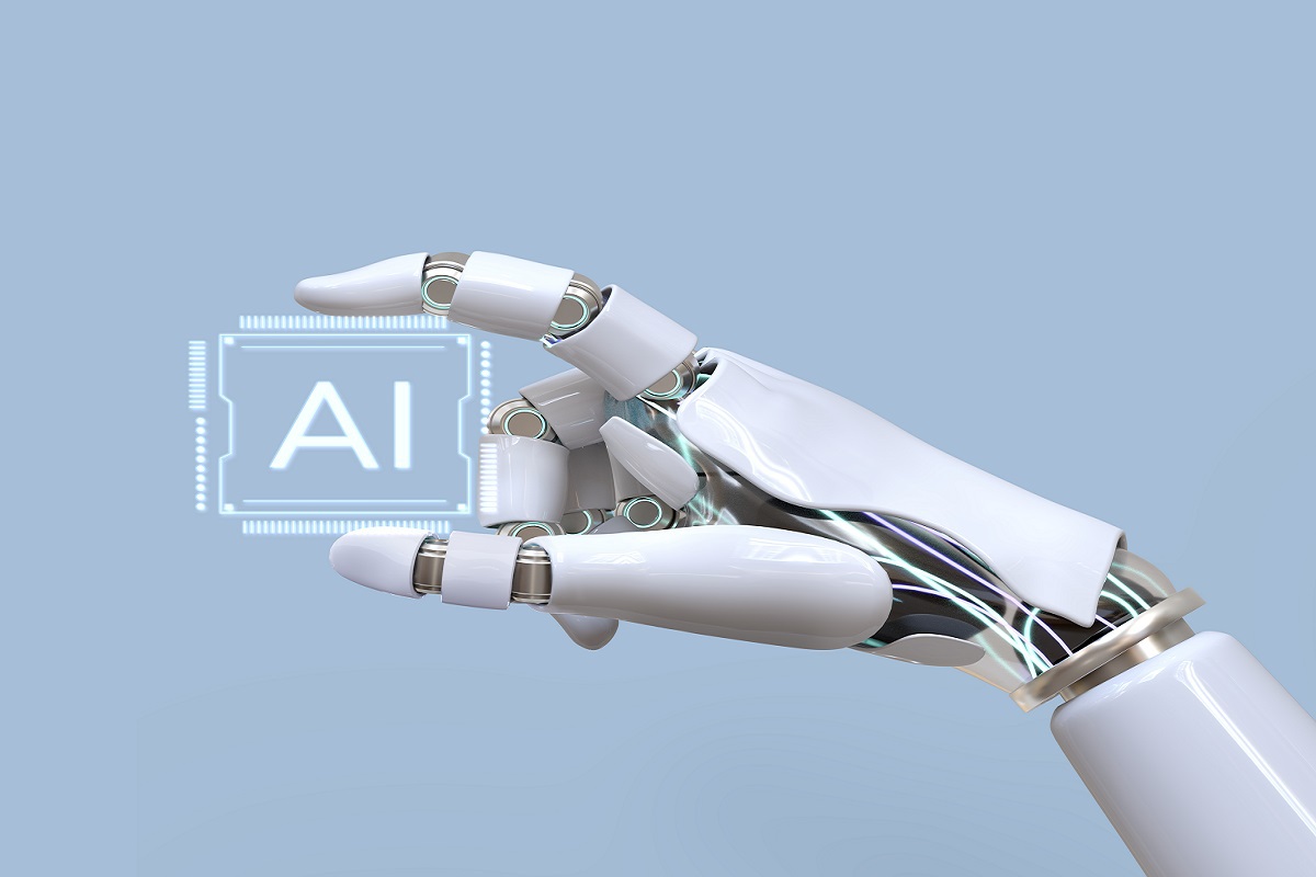 Mão de robô branca segurando chip com inscrições AI, que em português significa Inteligência Artificial, uma das Tecnologias do futuro